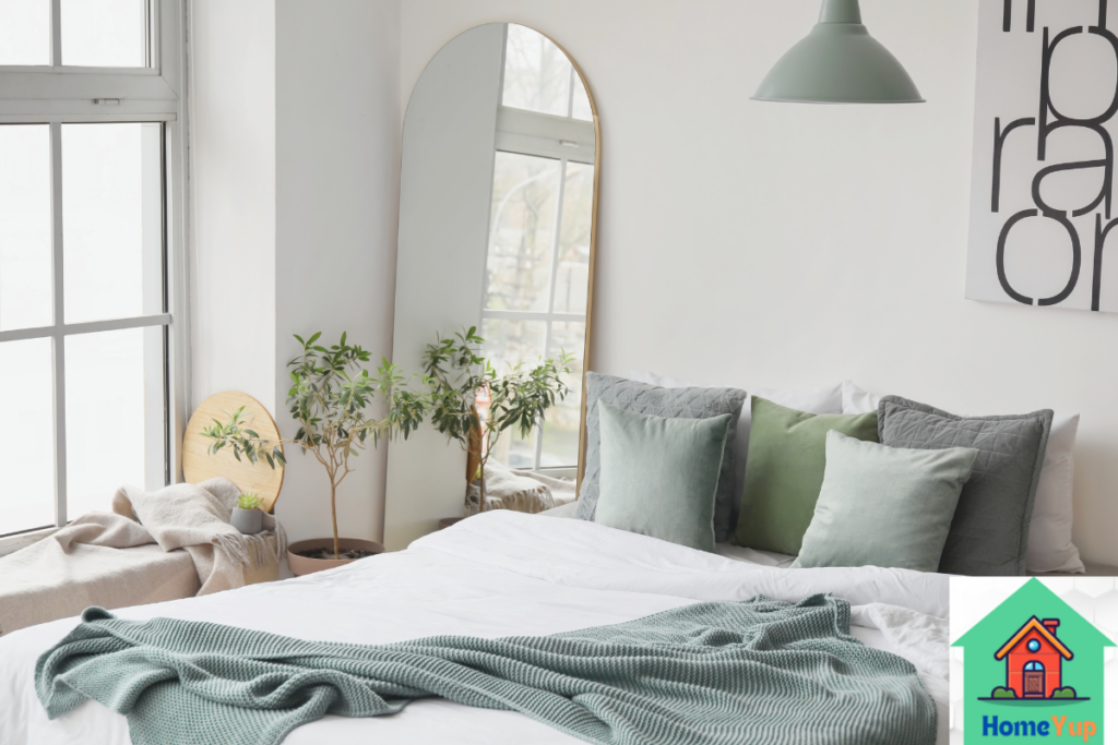 Cozy bedroom with large mirror side to the bed